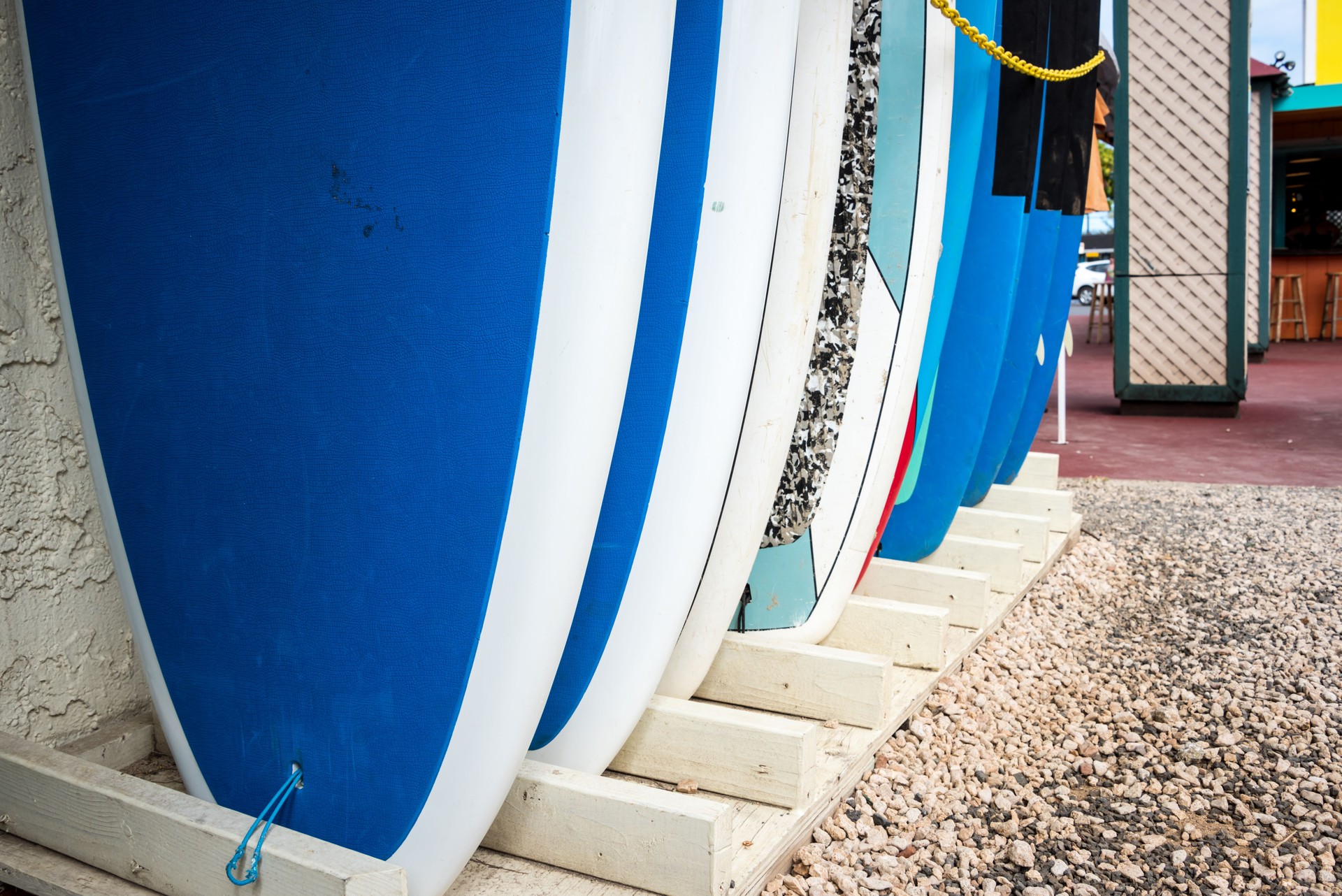 abstract image of surfboards for rent lined up in front of a store on Kauai, Hawaii